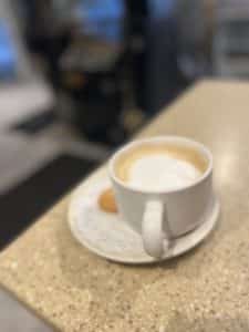 A beautifully designed cup of capuccino
